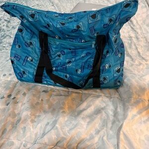 Cookie Monster weekender tote bag, folds up tiny, pack able blue all over print